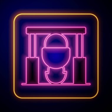 Glowing neon Campfire and pot icon isolated on black background. Fire camping cooking in cauldron on firewood and flame.  Vector