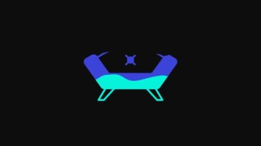 Yellow Sofa icon isolated on black background. 4K Video motion graphic animation.