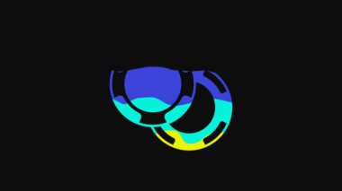Yellow Casino chips icon isolated on black background. Casino gambling. 4K Video motion graphic animation.
