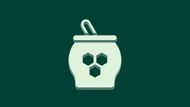 Weißes Glas Honig Und Honigdipper Symbol Isoliert Auf Grünem Hintergrund — Stockvideo