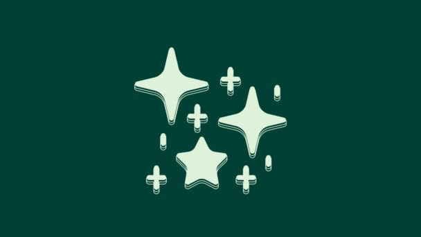 Weiße Funkelsterne Mit Magischen Glitzerpartikeln Auf Grünem Hintergrund Magische Weihnachtsdekoration — Stockvideo
