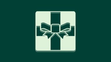 Yeşil arkaplanda beyaz hediye kutusu simgesi izole edildi. Mutlu Noeller ve mutlu yıllar. 4K Video hareketli grafik canlandırması.