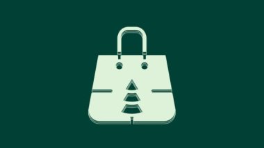 Yeşil arka planda kar tanesi ikonu olan beyaz Noel kâğıdı alışveriş torbası. Paket işareti. Mutlu Noeller ve mutlu yıllar. 4K Video hareketli grafik canlandırması.