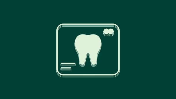 緑色の背景に分離された歯のアイコンの白いX線 歯科用X線 放射線画像 4Kビデオモーショングラフィックアニメーション — ストック動画