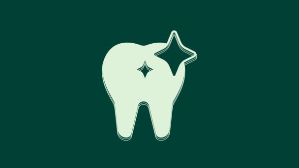 ホワイト歯のホワイトニングのコンセプトアイコンは緑の背景に隔離されています 歯科クリニックや歯科医療センターの歯のシンボル 4Kビデオモーショングラフィックアニメーション — ストック動画