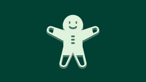 ホワイトホリデージンジャーブレッドマンクッキーアイコンは緑の背景に隔離されています アイシングの男の形をしたクッキー 4Kビデオモーショングラフィックアニメーション — ストック動画