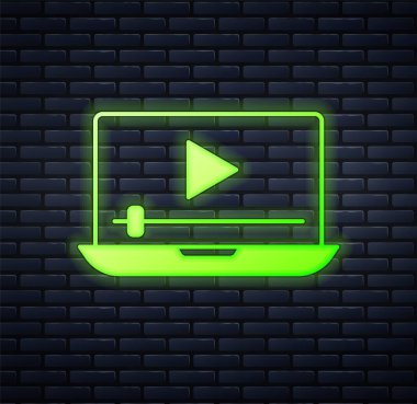 Parlayan neon çevrimiçi video oynatma simgesi tuğla duvar arka planında izole edildi. Dizüstü bilgisayar ve oyun işaretli film şeridi. Vektör
