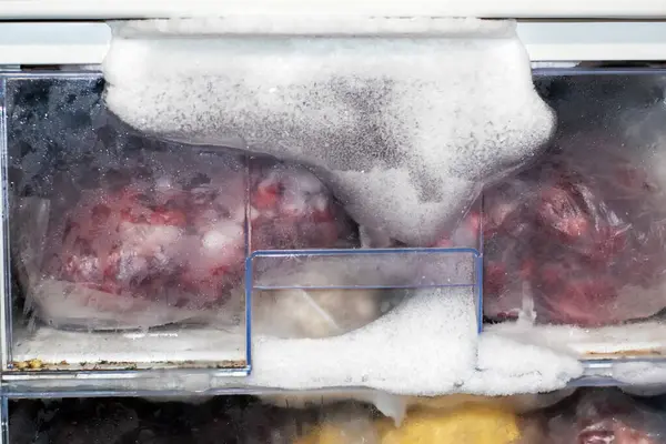 stock image Ice froze in the freezer because the door was not closed. Defrosting the refrigerator. defrosting the freezer.