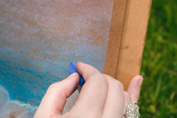 Closeup Caucasian Female Hands Outdoors Blue Chalk Drawing Canvas Concept — Stock Photo, Image