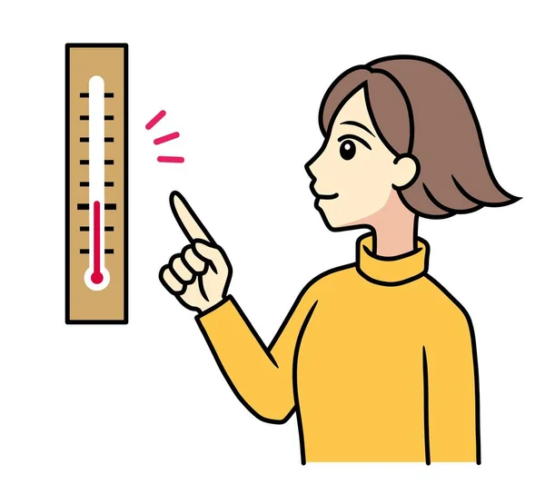 A young woman checking a temperature with a thermometer