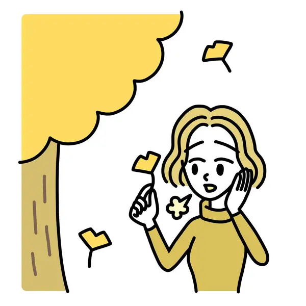 sentimental woman picking up leaf and sighing under tree