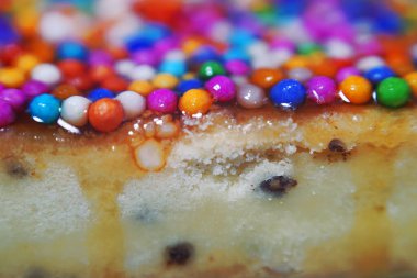 Colorful candy sprinkles in a close-up macro shot of Peruvian food: Turron 