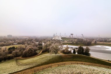 Olympia stadium in Munich, Germany under fog in winter clipart