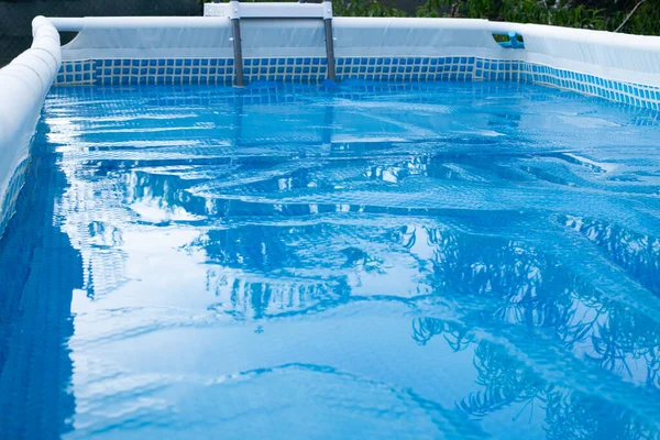 Swimming Pool with  solar film covers the pool.Film for heating water and protection pollution. Pool care