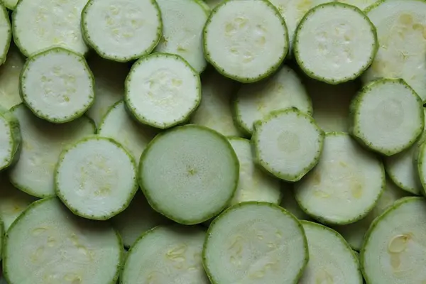 stock image Transverse round cuts of zucchini fixed with a close-up photo shooting. View from above.