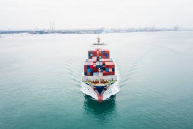 cargo container ship sailing in sea import and export business and industry logistic goods transportation of international by container ship in ocean fright aerial view photograph from drone 