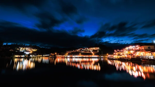 stock image Ban Rak Thai Village in the night scene shot and over lighting reflction on water, yunnan chinese village style it is famous tourist attrction and landmark of Mae Hong Son Province , Northern Thailand, 