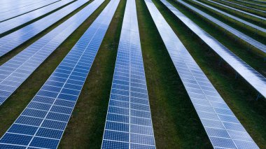 Solar panels (solar cell) in solar farm clean energy tecnologyfor the future concept, photograph from drone 