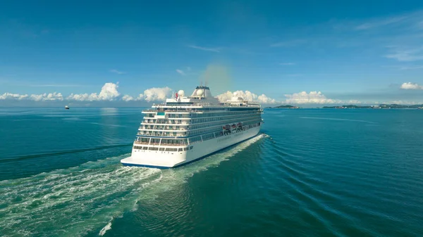 large luxury and high-class white cruise ship viking norway sailing in the ocean with blue sky background of thailand, travel to travel relax and spa healthy concept,