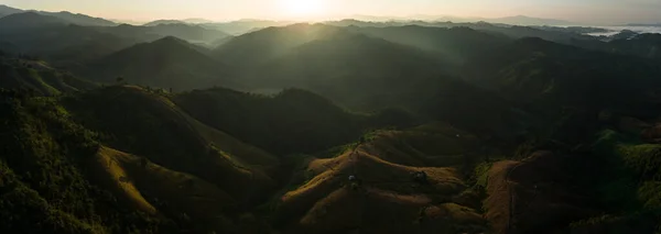 Panorama Landscape light and shadow of the mountain where the sun shines in the morning is a very beautiful and dramatic landscape, aerial view panoramic photograph from drone for background abstrac