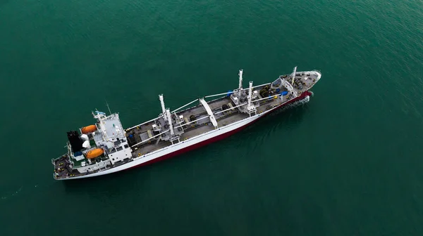 shipping, ship floating in middle sea aerial view from drone