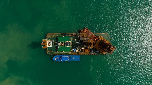 marine research vessel-scout oil fields with a small rig, aerial top view