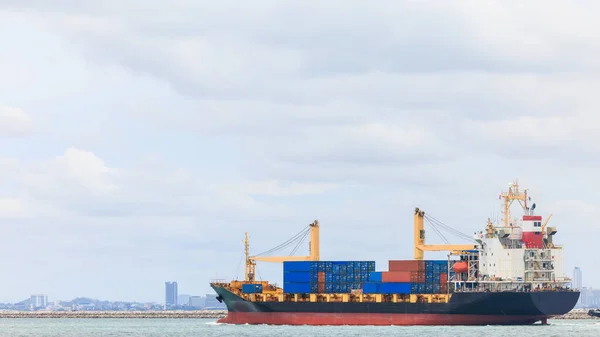 container ship transporting cargo logistics import export goods international around the world including Asia Pacific and Europe, global business and industry delivery services transportation ship box-container by sea, aerial drone point of view