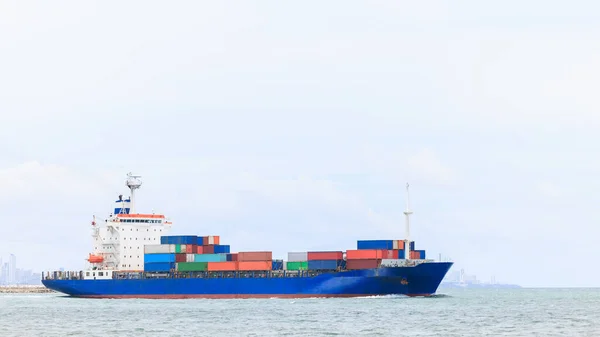container ship transporting cargo logistics import export goods international around the world including Asia Pacific and Europe, global business and industry delivery services transportation ship box-container by sea, aerial drone point of view