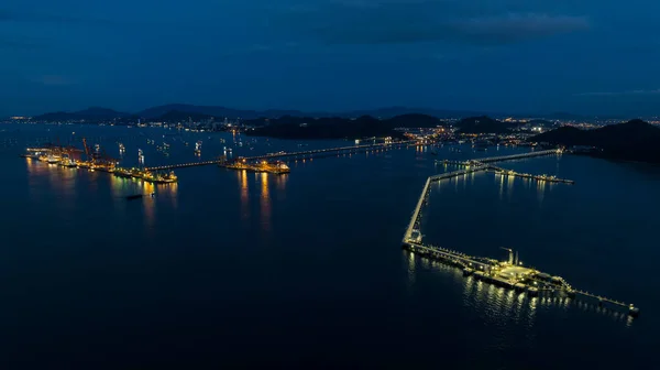 stock image Seascape at twilight over lighting station and crude oil pipeline with commercial port. aerial view 