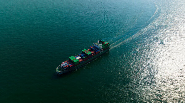 container cargo ship import export global business and industry commercial trade logistic and transportation of international by container cargo ship in the open sea, Container cargo freight shipping, front view drone shot,