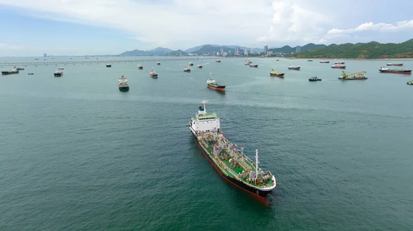 Aerial view tanker ship anchor parking in sea, Crude oil tanker ship and GAS, LPG tanker ship loading in bay, business and industry about transportation, fuel and energy waste,