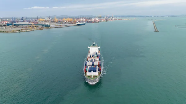 cargo container ship sailing full speed in sea to import export goods and distributing products to dealer and consumers across worldwide, by container ship Transport open sea. aerial view