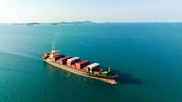 cargo container ship carrying in sea import export goods and distributing products to dealer consumers across Asia pacific and worldwide global business transportation by container ship open sea aerial view