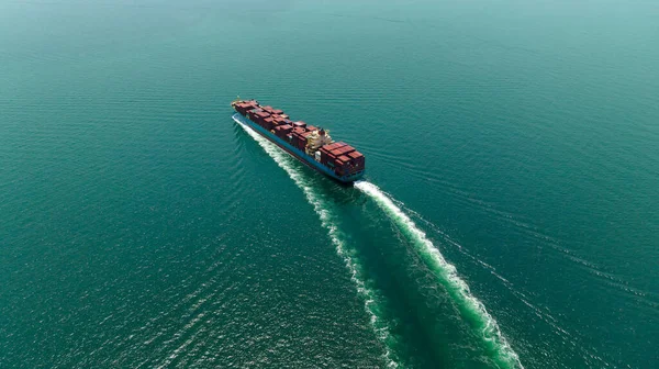 cargo container ship sailing full speed in sea to import export goods and distributing products to dealer and consumers worldwide, by container ship Transport, business logistic delivery service, aerial view