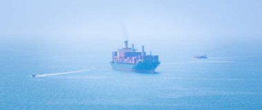 panorama of large container ship sailing on deep sea, fully loaded with multi-colored containers, reflecting global business maritime transport cargo logistics, 