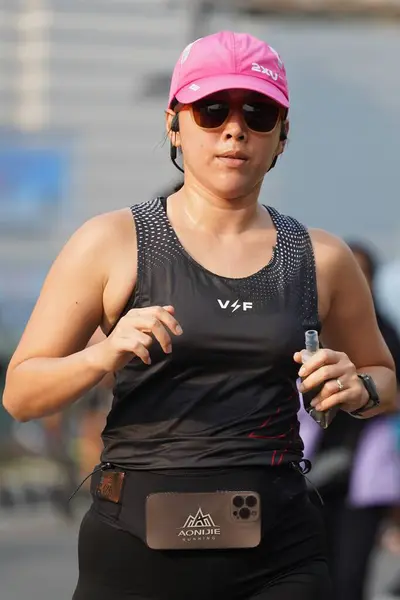 stock image Jakarta, Indonesia on June 12,2024 : Asian people are jogging in the Sudirman-Thamrin area, Central Jakarta. car free day Sudirman - Thamrin. defocused