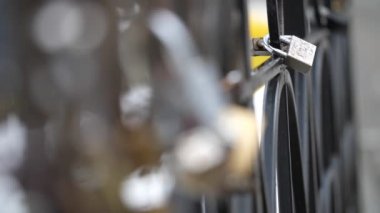 Metal locks on the fence as a symbol of love and mutual feelings of the newlyweds.