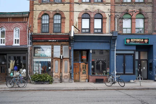 stock image Toronto, Canada - November 2022:  Colorful stores and restaurants on Ossington Avenue, a trendy neighborhood, in original 19th century buildings 