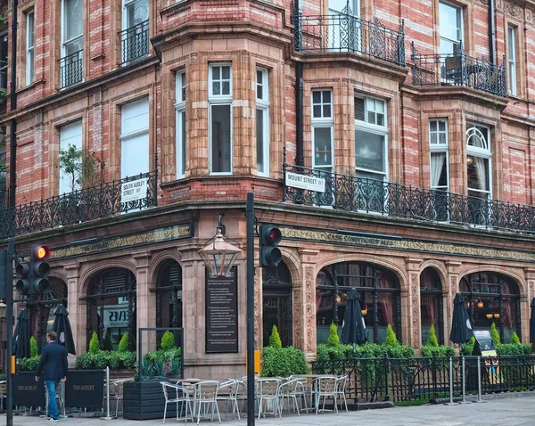 stock image London, UK - September 2016: Elegant pub at the corner of Audley street in  Mayfair, with plaque describing the history of the name