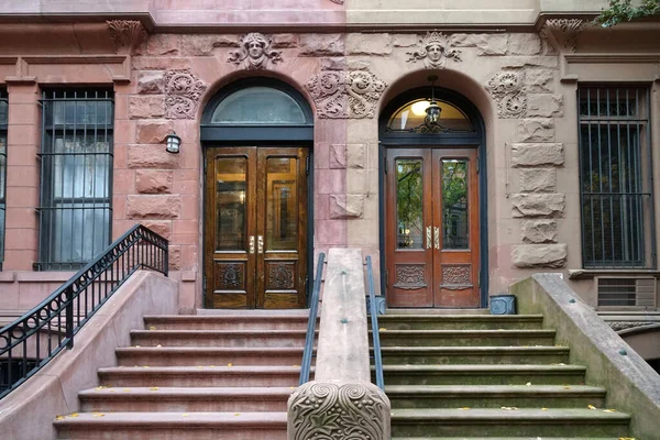 Stone staircase leading up to front door of New York townhouse