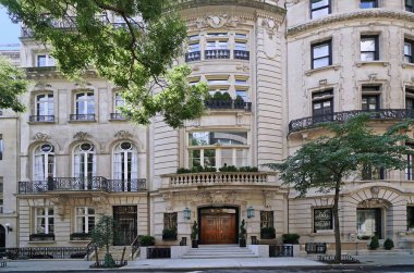 Row of elegant old New York townhouses in French Beaux Arts style clipart