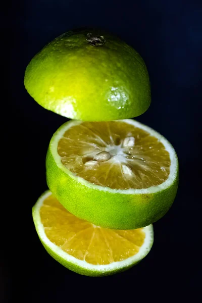 Yellow Green Sweet Lemon Slices Isolated Dark Blue Background Macro — Stock Photo, Image