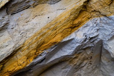 texture of natural sand stone for background Rock formations slice of sand with layers of different structures clay  soil.  Sand quarry. Picturesque sandstones.  mountain closeup