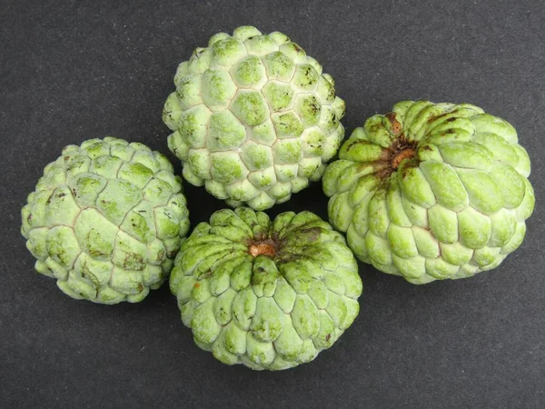 Sugar apple fruits on black background top view