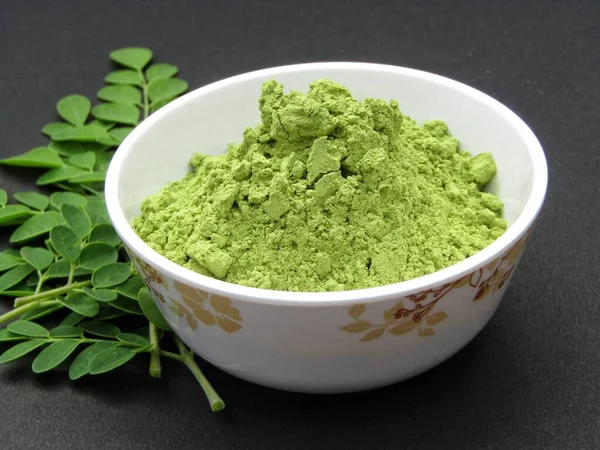 Moringa oleifera leaves powder in a bowl 