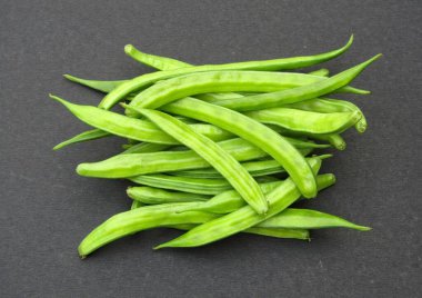 Fresh Guar or cluster beans on black background 