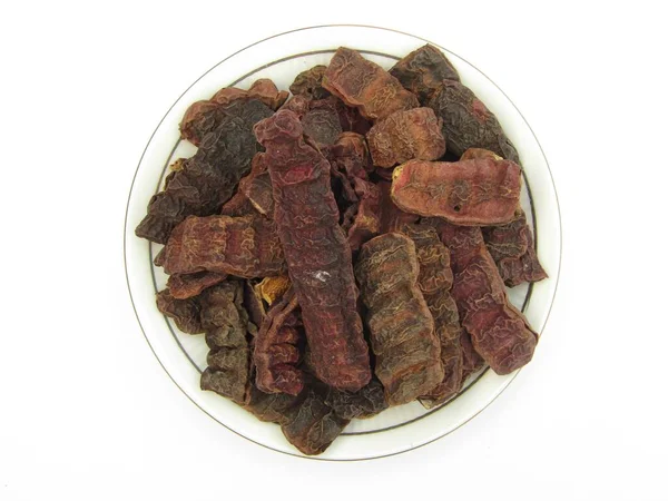 Dried Acacia concinna or Shikakai on a plate 