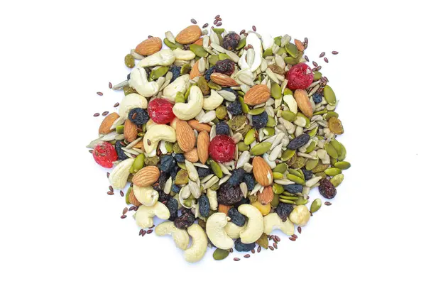 Trail mix nuts and seeds on white background top view