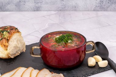 Borsch. Traditional Ukrainian borsch with sour cream in a bowl. National dish of Ukraine: red borscht, lard, garlic.