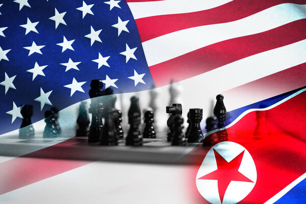 Concept of Bilateral relationship between two countries showing with two flags: United States of America and North Korea. High quality photo